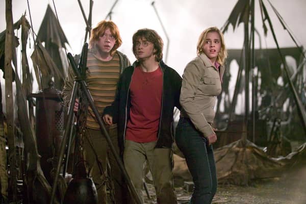 RUPERT GRINT as Ron Weasley, DANIEL RADCLIFFE as Harry Potter and EMMA WATSON as Hermione Granger in Warner Bros. Pictures’ ‘Harry Potter and the Goblet of Fire’.