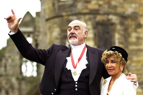  Actor Sir Sean Connery, with wife Micheline, donning full Highland dress and wearing his medal after he was formally knighted by the Queen during a investiture ceremony, at the Palace of Holyroodhouse in Edinburgh. * Connery knelt while the Queen touched his shoulders lightly with a sword and made him a Knight during the ceremony in the Palace's Picture Gallery.