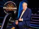 Jeremy Clarkson, sat in the host’s chair on set of Who Wants to be a Millionaire? (Credit: Stellify Media)