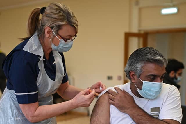  Vaccinations will be offered first to frontline health and social care workers and those who are most vulnerable to the effects of the virus. (Photo by Oli Scarff/AFP/Getty Images)