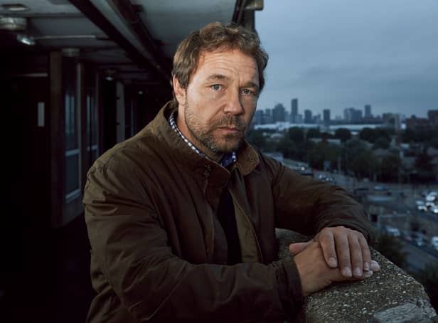 <p>Steven Graham in The Walk-In, on the balcony of a housing block (Credit: ITV)</p>