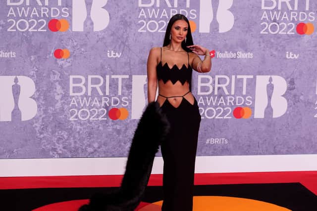 British TV host Maya Jama poses on the red carpet upon her arrival for the BRIT Awards 2022
