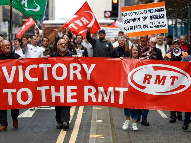 RMT supporters march from the offices of Network Rail as a nationwide strike called by the RMT Union was held today on July 27, 2022 in Glasgow, Scotland (Photo by Jeff J Mitchell/Getty Images)