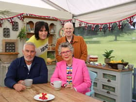 Noel Fielding and Matt Lucas stood behind Paul Hollywood and Prue Leith. A custard cake is sat on the table in front of them (Credit: Channel 4)