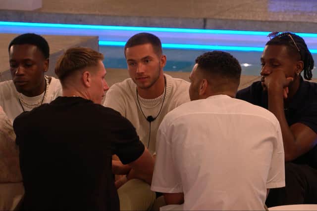 The male islanders talking about the game, just before the drama erupted. (Photo by ITV)
