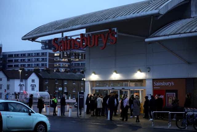 People queue outside the Sainsbury in Maidstone after reports they would be stocking the in demand drink 'Prime' February 21 2023. 