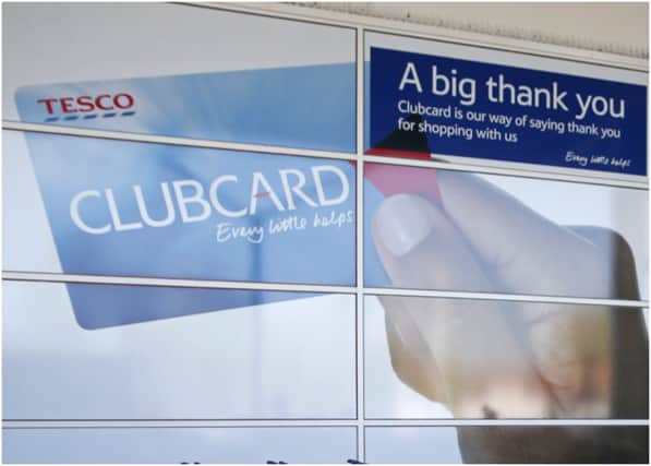 A man shops at a Tesco supermarket in Sunbury, west of London on April 22, 2015. Britain's biggest retailer, supermarket group Tesco, announced Wednesday that it had plunged massively into the red last year as it took a hit on the value of its property. AFP PHOTO / ADRIAN DENNIS (Photo credit should read ADRIAN DENNIS/AFP via Getty Images)
