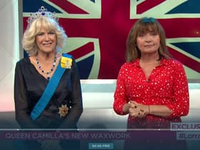 Lorraine Kelly poses with Queen Consort Camilla’s waxwork