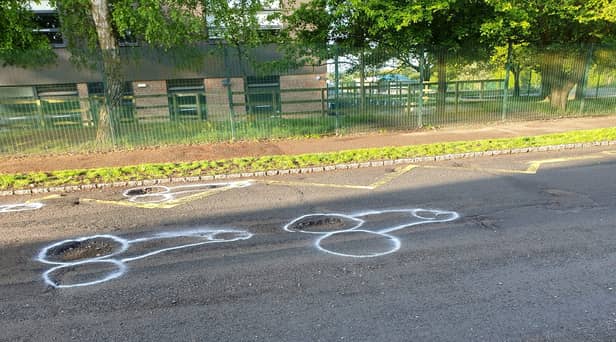 Locals appear to have lost patience waiting for the holey highway in East Sussex to be repaired - and the resulting crude phallus drawings have attracted interest online. 