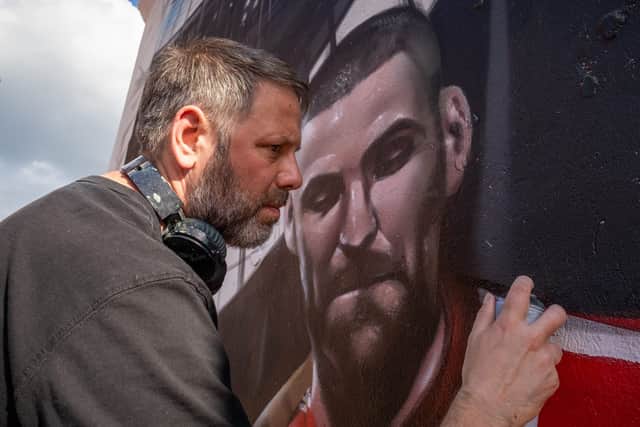 Artist Jody Thoms works on Sky HDR Art mural on Tottenham High road in London the art work is to celebrate Sky’s Q Ultra HD and features some of the nation’s favourite Premier league players.