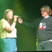 Lewis Capaldi is joined by a fan to perform the song Someone You Loved at Bristol Marble Factory