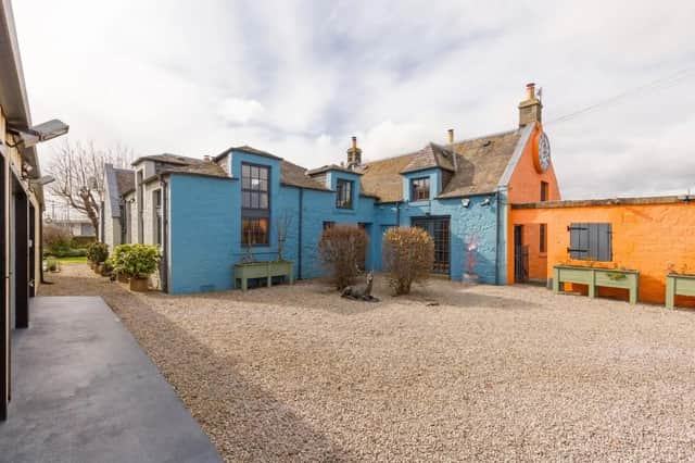 For Sale: Zany detached schoolhouse with a back-wall bookcase, mezzanine and triple garage for £795k