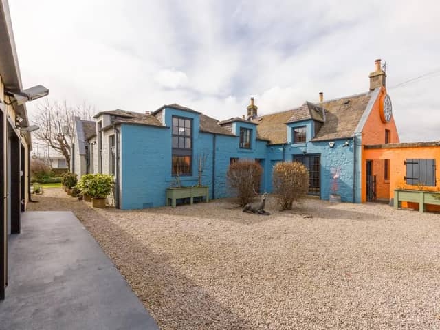 For Sale: Zany detached schoolhouse with a back-wall bookcase, mezzanine and triple garage for £795k