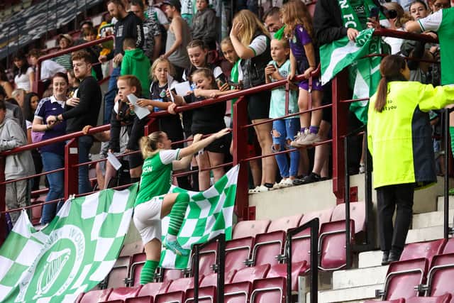 Abbie Ferguson celebrates the win with Hibs fans at Tynecastle