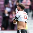 Aberdeen’s Graeme Shinnie looks dejected at full time after Hearts’ win.