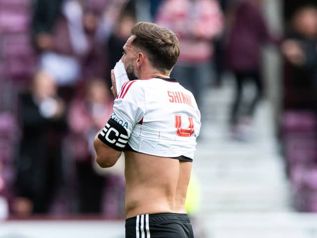Aberdeen’s Graeme Shinnie looks dejected at full time after Hearts’ win.