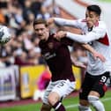 Rowles defends against Aberdeen’s Bojan Miovski