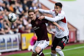 Rowles defends against Aberdeen’s Bojan Miovski