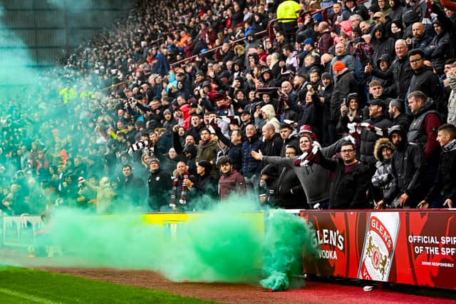 Hibs fans sent a smoke bomb to Hearts fans at Tynecastle during the Edinburgh Derby