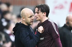 Hearts head coach Steven Naismith with midfielder Alex Lowry. Pic: SNS
