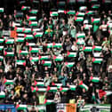 The Celtic away fans all show their support for Palestine amid the ongoing Israeli-Palestinian conflict