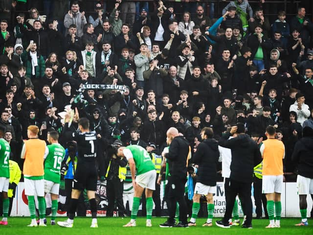 Hibs fans applaud their team after draw at Hearts.
