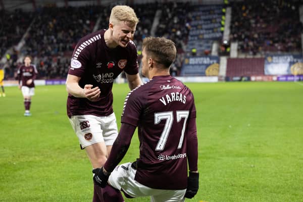 Kenneth Vargas celebrates with Alex Cochrane following his goal against Livingston.
