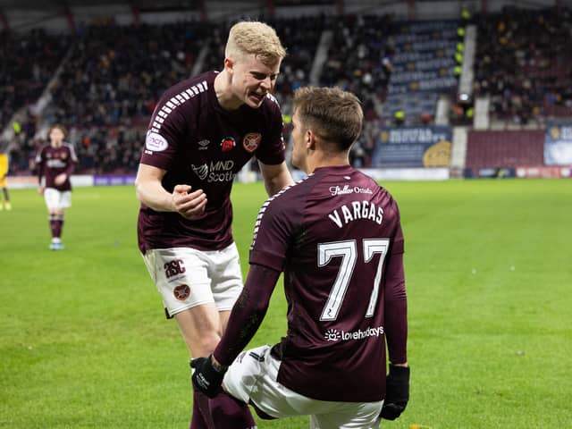 Kenneth Vargas celebrates with Alex Cochrane following his goal against Livingston.