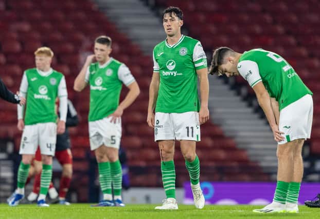 A picture of dejection - Hibs players at full-time. 