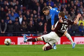 Kye Rowles attempts to stop Rangers' second goal in semi-final clash