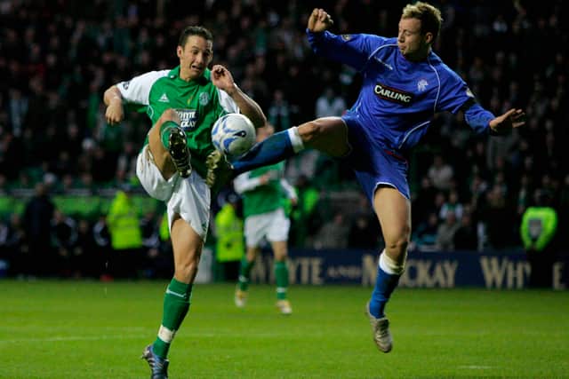 Beuzelin in action against Rangers defender Alan Hutton.