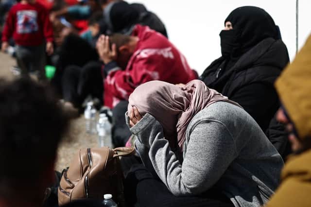 Exhausted migrants in Kent. Credit: HENRY NICHOLLS/AFP via Getty Images