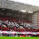 A sea of red and white flags are shown as Hearts played Hibs at Tynecastle.