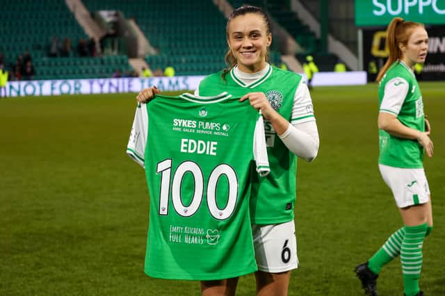 Leah Eddie holding up her 100 appearances shirt after the Edinburgh derby. Credit: David Mollison