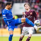 Alex Lowry in action for Hearts against St Johnstone's  Oludare Olufunwa in August. Pic: SNS
