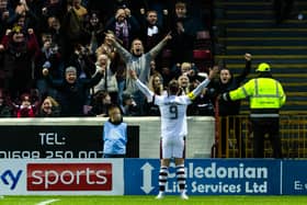 Hearts captain Lawrence Shankland celebrates helping his club to fourth place