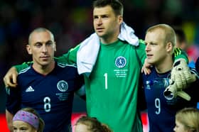 Marshall flanked by Scott Brown and Steven Naismith on Scotland duty.