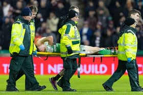 Campbell is stretchered off at Easter Road
