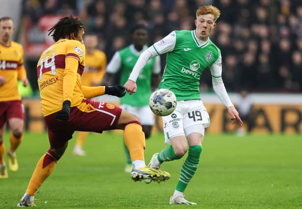Rory Whittaker takes on Theo Bair in 2-2 draw with Motherwell.