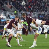 Frankie Kent and Stephen Kingsley in action for Hearts