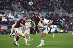 Frankie Kent and Stephen Kingsley in action for Hearts