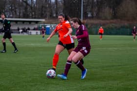 Jessica Husband battles to keep possession for Hearts. Credit: Hearts Women