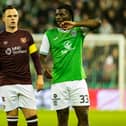 Hearts' Lawrence Shankland and Hibs' Rocky Bushiri in action at Easter Road