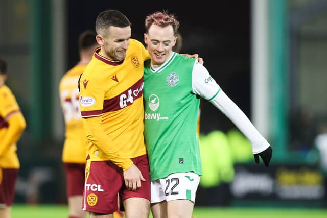 McKirdy is greeted by Paul McGinn following Easter Road return