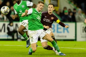Will Fish attempts to stop Lawrence Shankland from scoring at Easter Road