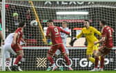 Lawrence Shankland scores past Kelle Roos at Pittodrie
