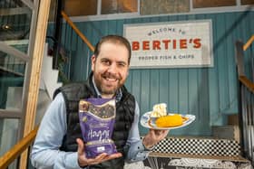 Berties owner Alberto Crolla, pictured holding a deep fried chocolate haggis and ice cream dish. Photo by Phil Wilkinson.