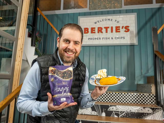 Berties owner Alberto Crolla, pictured holding a deep fried chocolate haggis and ice cream dish. Photo by Phil Wilkinson.