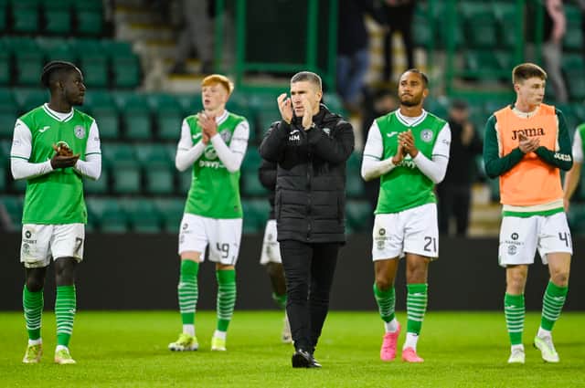 Monty and his players applaud the few Hibs fans remaining at full-time.