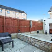 Outside, the home has a small front garden area and a split-level, enclosed rear garden. The latter benefits from a lawned area, and two paved patios. The property also benefits from two allocated parking spaces.